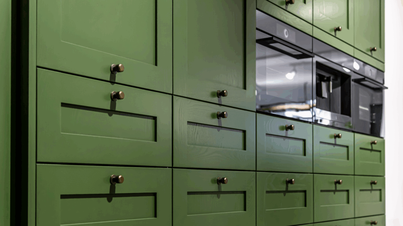 A wall of green cabinets.