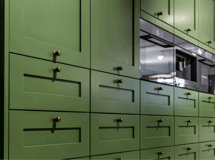 A wall of green cabinets.