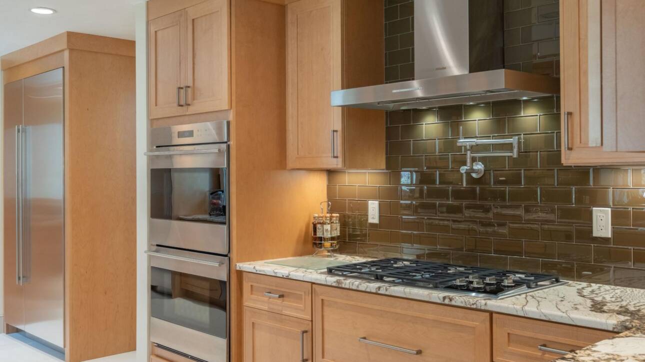 A modern kitchen with wooden cabinets.