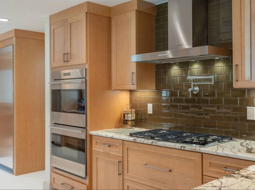 A modern kitchen with wooden cabinets.